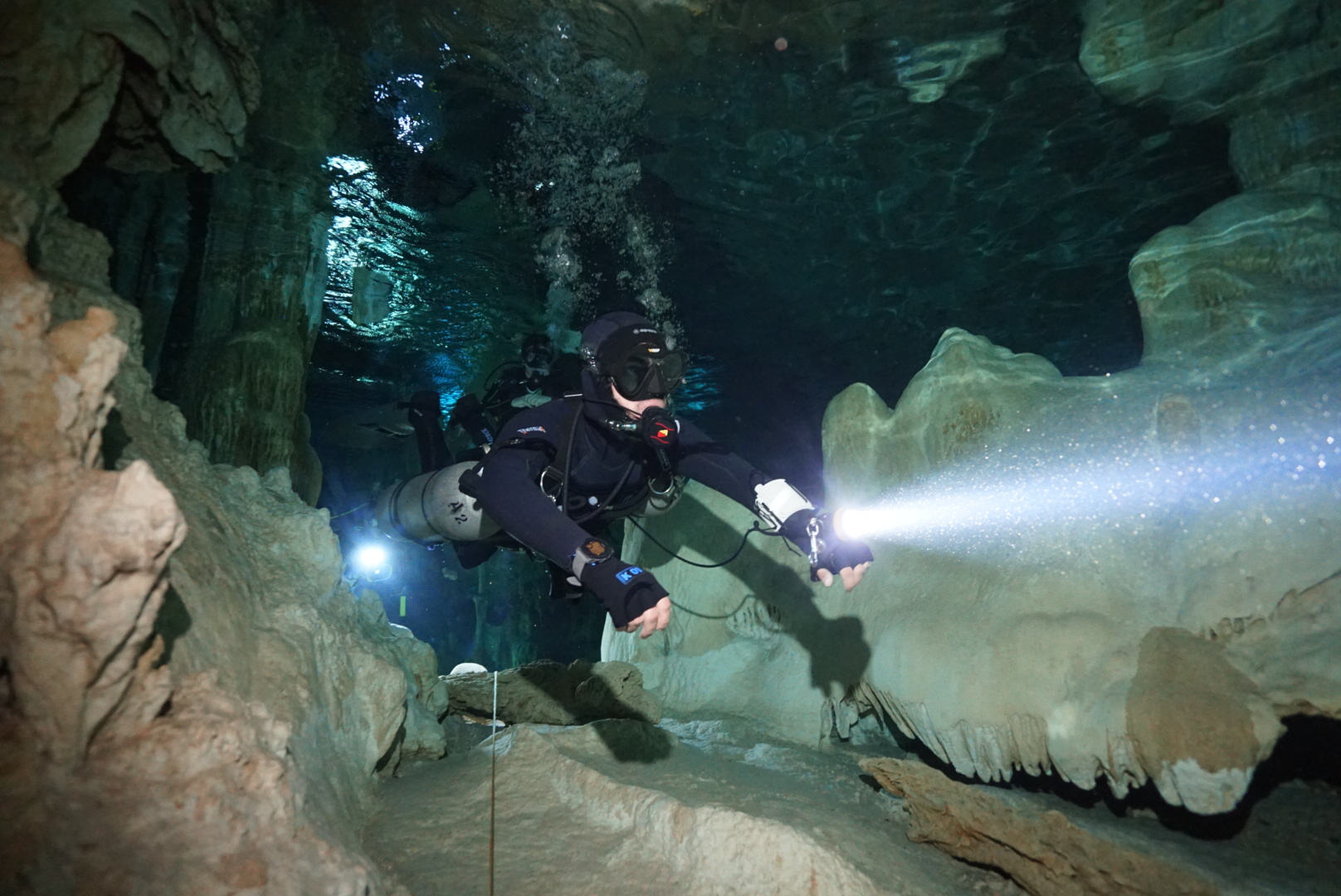 Scuba diver exploring a cenote cavern